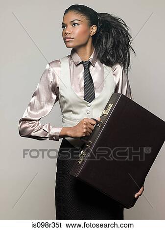 Businesswoman holding briefcase View Large Photo Image Stock Photograph - Businesswoman holding briefcase. Fotosearch