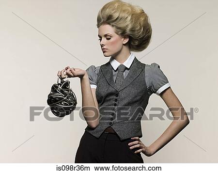 Picture - Businesswoman holding cable. Fotosearch