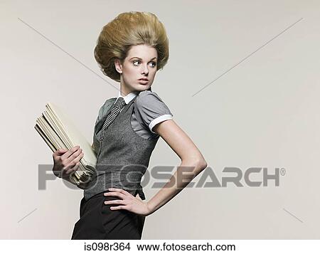 Businesswoman holding files View Large Photo Image Picture - Businesswoman holding files. Fotosearch