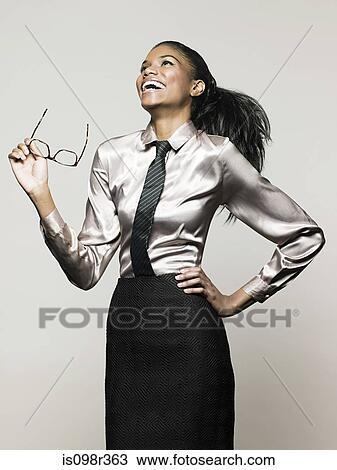 Businesswoman holding glasses View Large Photo Image Stock Image - Businesswoman holding glasses. Fotosearch