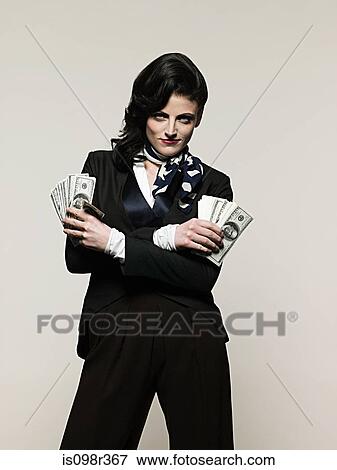 Businesswoman holding money View Large Photo Image Stock Photo - Businesswoman holding money. Fotosearch
