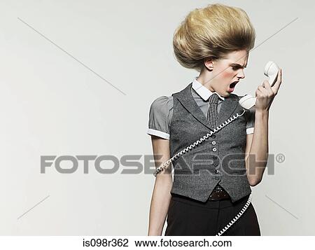 Stock Image - Businesswoman on telephone. Fotosearch