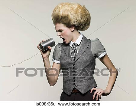 Businesswoman on tin can phone View Large Photo Image Stock Photograph - Businesswoman on tin can phone. Fotosearch