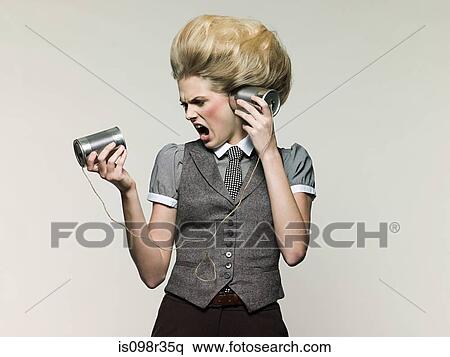 Businesswoman on tin can phone View Large Photo Image Stock Photography - Businesswoman on tin can phone. Fotosearch