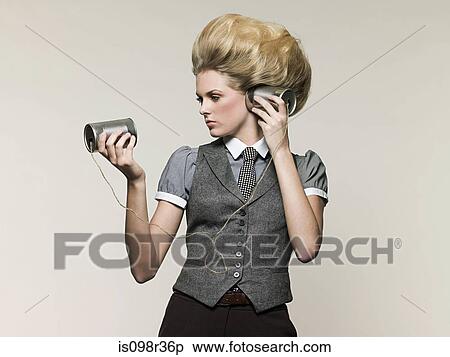 Businesswoman on tin can phone View Large Photo Image Stock Photography - Businesswoman on tin can phone. Fotosearch