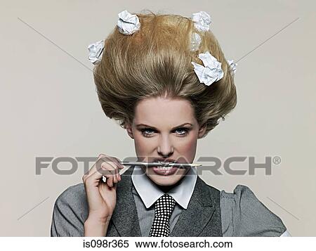 Businesswoman with pencil and paper in hair View Large Photo Image Stock Photography - Businesswoman with pencil and paper in hair. Fotosearch