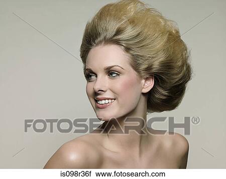 Stock Image - Smiling young woman. Fotosearch