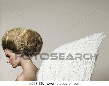 Young woman wearing angel wings View Large Photo Image Stock Photo - Young woman wearing angel wings. Fotosearch