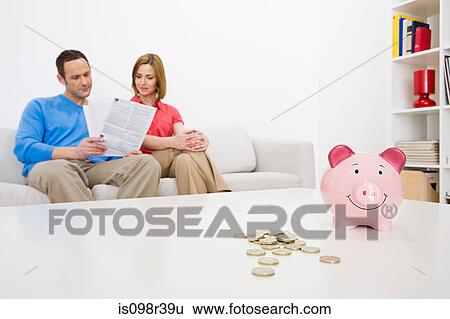 Couple sitting and reading View Large Photo Image Stock Photograph - Couple sitting and reading. Fotosearch