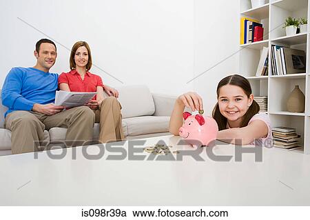 Family with piggy bank View Large Photo Image Stock Image - Family with piggy bank. Fotosearch