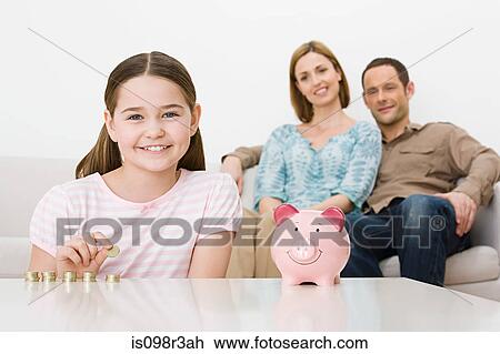Family with piggy bank View Large Photo Image Stock Image - Family with piggy bank. Fotosearch