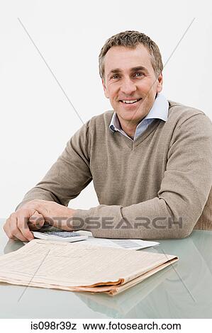 Man with paperwork View Large Photo Image Stock Photo - Man with paperwork. Fotosearch