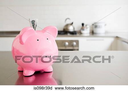 Piggy bank with money in slot View Large Photo Image Stock Image - Piggy bank with money in slot. Fotosearch