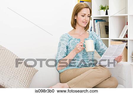 Woman sitting and reading View Large Photo Image Stock Image - Woman sitting and reading. Fotosearch
