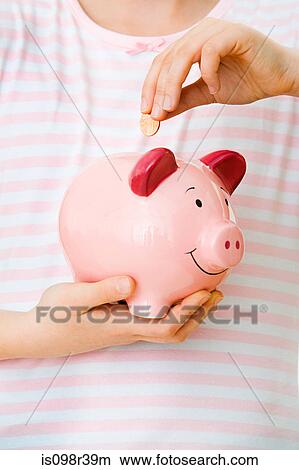 Young girl with piggy bank View Large Photo Image Picture - Young girl with piggy bank. Fotosearch