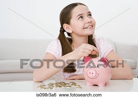 Young girl with piggy bank View Large Photo Image Stock Photograph - Young girl with piggy bank. Fotosearch