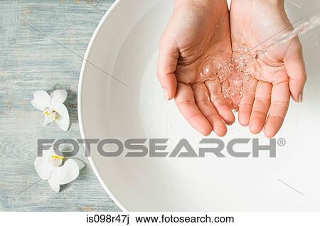 Person with hands in running water View Large Photo Image Stock Image - Person with hands in running water. Fotosearch