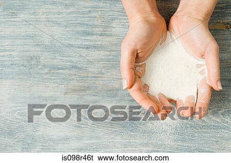 Woman holding sand View Large Photo Image Stock Photograph - Woman holding sand. Fotosearch
