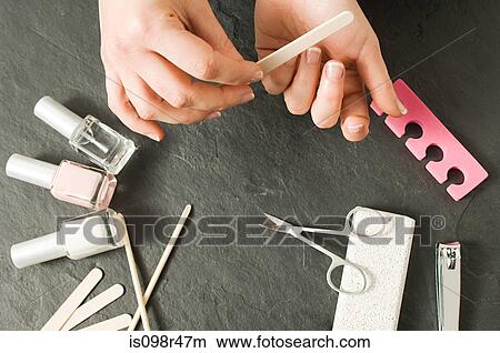 Woman manicuring hands View Large Photo Image Picture - Woman manicuring hands. Fotosearch