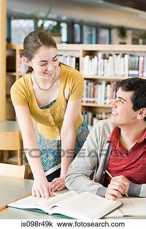 Stock Image - Boy and girl studying. Fotosearch