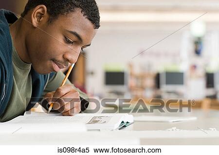 Stock Photography - Boy studying. Fotosearch