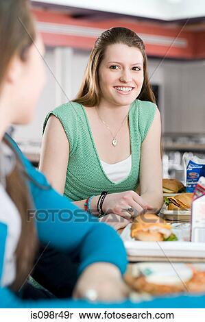 Female school students having lunch View Large Photo Image Stock Photography - Female school students having lunch. Fotosearch