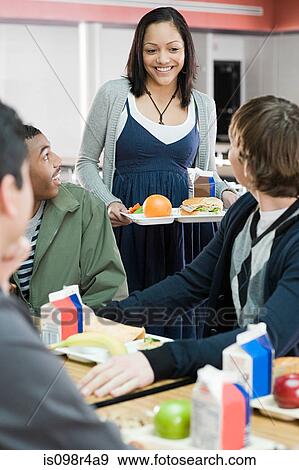 Girl and boys at lunch View Large Photo Image Stock Photo - Girl and boys at lunch. Fotosearch