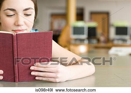 Girl reading a book View Large Photo Image Stock Image - Girl reading a book. Fotosearch