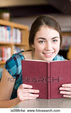 Girl with a book View Large Photo Image Stock Image - Girl with a book. Fotosearch