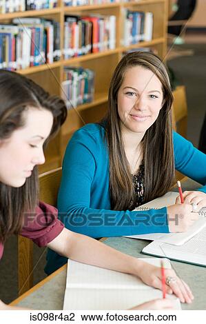 Stock Image - Girls studying. Fotosearch