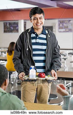 Male school student at lunch View Large Photo Image Picture - Male school student at lunch. Fotosearch