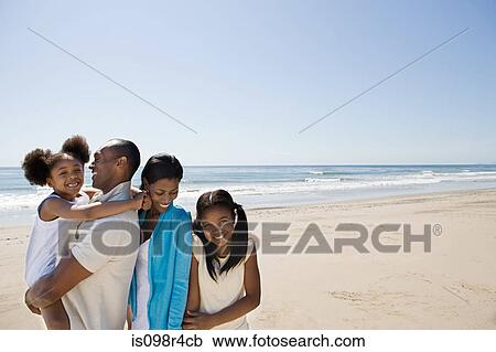 Stock Image - African american family on a beach. Fotosearch