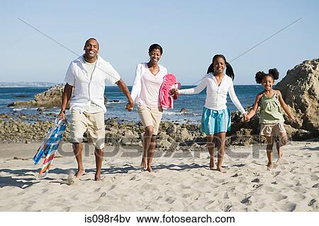 Stock Photo - African american family on a beach. Fotosearch