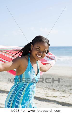Girl running on a beach View Large Photo Image Stock Photography - Girl running on a beach. Fotosearch