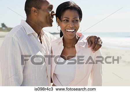 Romantic couple on a beach View Large Photo Image Stock Image - Romantic couple on a beach. Fotosearch