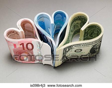 Banknotes in heart shapes View Large Photo Image Stock Image - Banknotes in heart shapes. Fotosearch