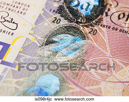 Stock Image - Close up of twenty pound note. Fotosearch