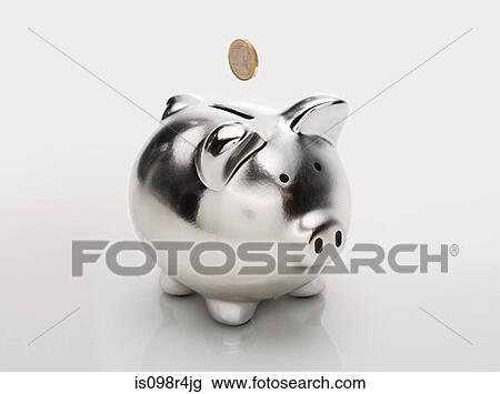 Stock Image - Coin and piggybank. Fotosearch