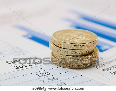 One pound coins and and financial papers View Large Photo Image Stock Image - One pound coins and and financial papers. Fotosearch