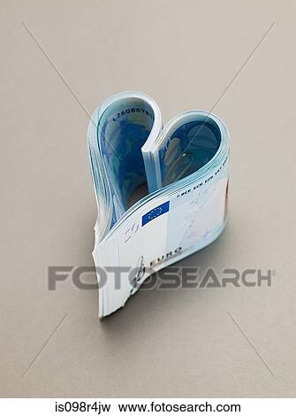 Twenty euro notes in heart shape View Large Photo Image Stock Photo - Twenty euro notes in heart shape. Fotosearch
