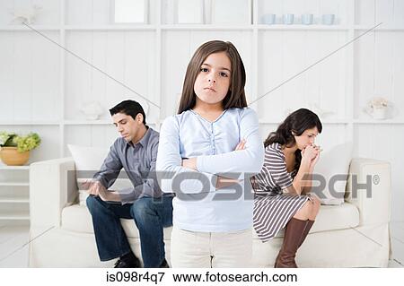 Hispanic girl with hostile parents View Large Photo Image Stock Photo - Hispanic girl with hostile parents. Fotosearch