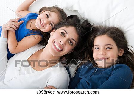 Stock Image - Hispanic mother and daughters. Fotosearch