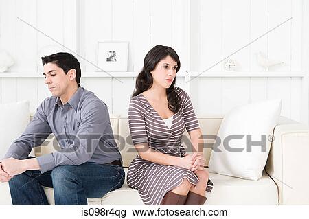 Stock Image - Hostile couple in a living room. Fotosearch