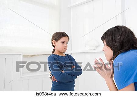 Mother disciplining her daughter View Large Photo Image Stock Image - Mother disciplining her daughter. Fotosearch