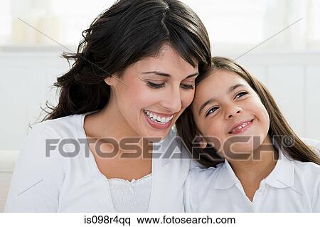 Stock Photography - Portrait of an hispanic mother and daughter. Fotosearch