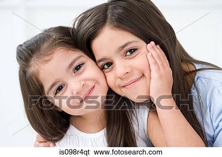 Portrait of two hispanic sisters View Large Photo Image Stock Photograph - Portrait of two hispanic sisters. Fotosearch