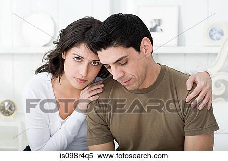 Stock Photography - Sad looking hispanic couple. Fotosearch