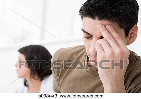 Stock Image - Stressed couple arguing. Fotosearch