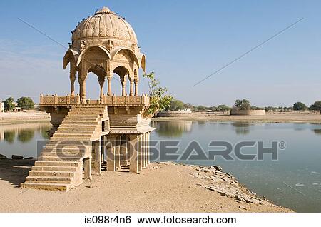 Stone tower by gadi sagar lake View Large Photo Image Stock Photograph - Stone tower by gadi sagar lake. Fotosearch