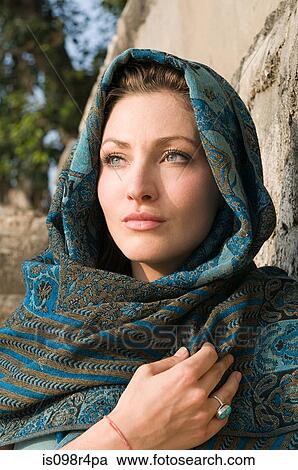 Young woman wearing headscarf View Large Photo Image Stock Image - Young woman wearing headscarf. Fotosearch